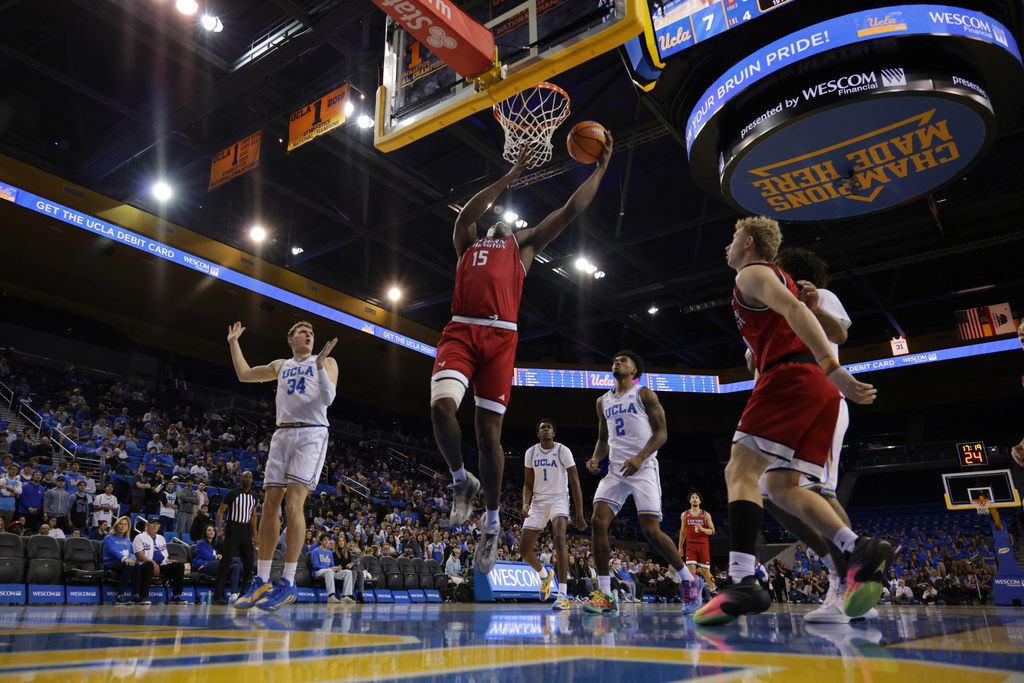 Eastern Washington forward Kiree Huie (15) lays up the ball against UCLA during the first half of an NCAA college basketball game Monday, Nov. 3, 2025, in Los Angeles. (AP Photo/Ethan Swope)