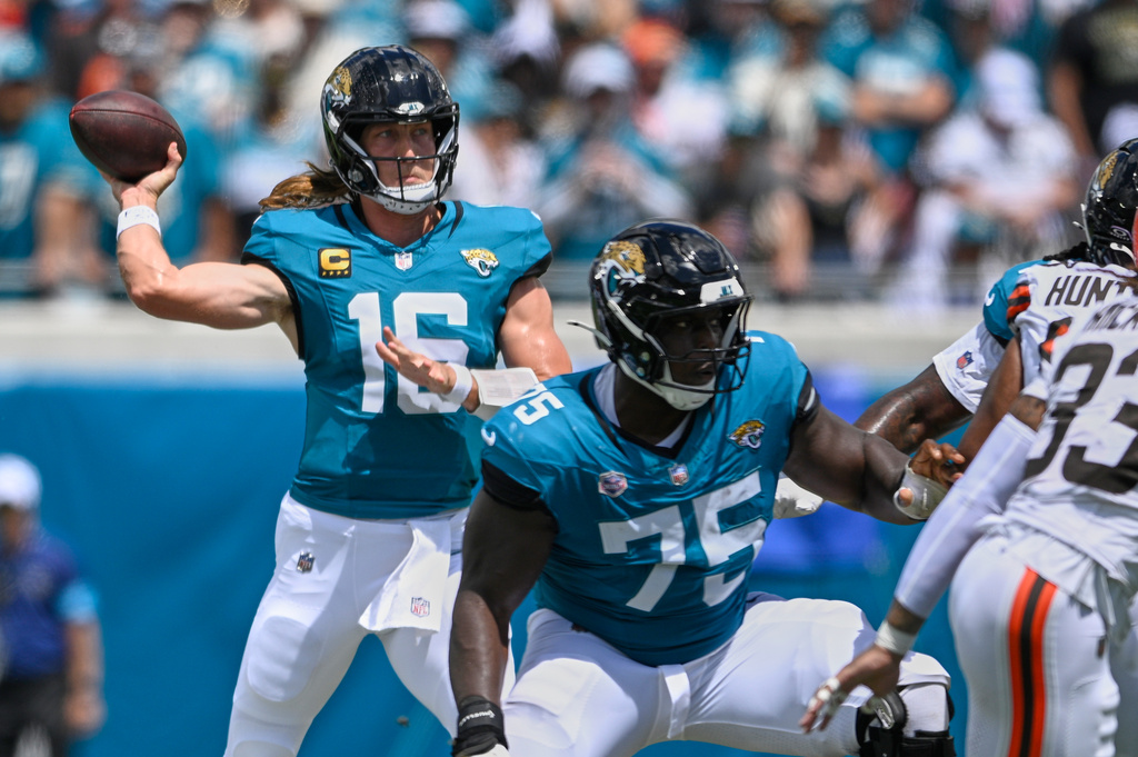 Jacksonville Jaguars quarterback Trevor Lawrence (16) passes in the first half of an NFL football game against the Cleveland Browns, Sunday, Sept. 13, 2026, in Jacksonville. (AP Photo/Phelan M. Ebenhack)