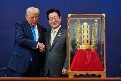 President Donald Trump shakes hands with South Korean President Lee Jae Myung as he receives a gift of a gold crown and an award of the Grand Order of Mugunghwa, not seen, during a high honor ceremony at the Gyeongju National Museum in Gyeongju, South Korea, Wednesday, Oct. 29, 2025. (AP Photo/Mark Schiefelbein) President Donald Trump shakes hands with South Korean President Lee Jae Myung as he receives a gift of a gold crown and an award of the Grand Order of Mugunghwa, not seen, during a high honor ceremony at the Gyeongju National Museum in Gyeongju, South Korea, Wednesday, Oct. 29, 2025. (AP Photo/Mark Schiefelbein)