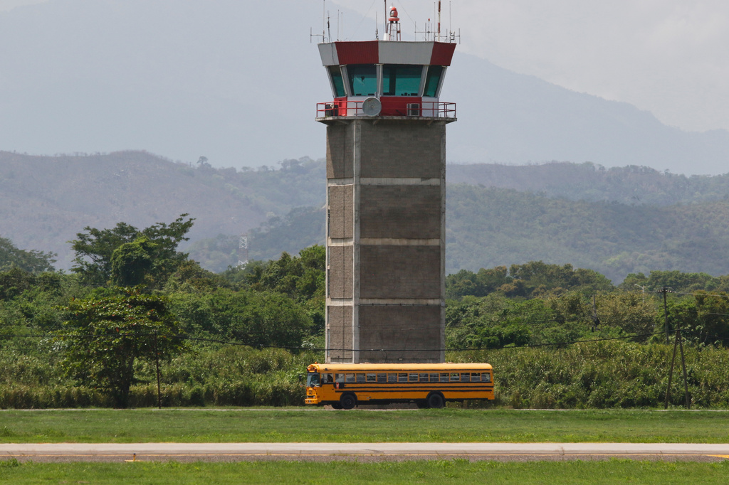 Migrants deported from the United States are transported in a bus after arriving on plane at the Ramon Villeda Morales Airport in San Pedro Sula, Honduras, Thursday, Aug. 20, 2026. (AP Photo/Delmer Martinez)