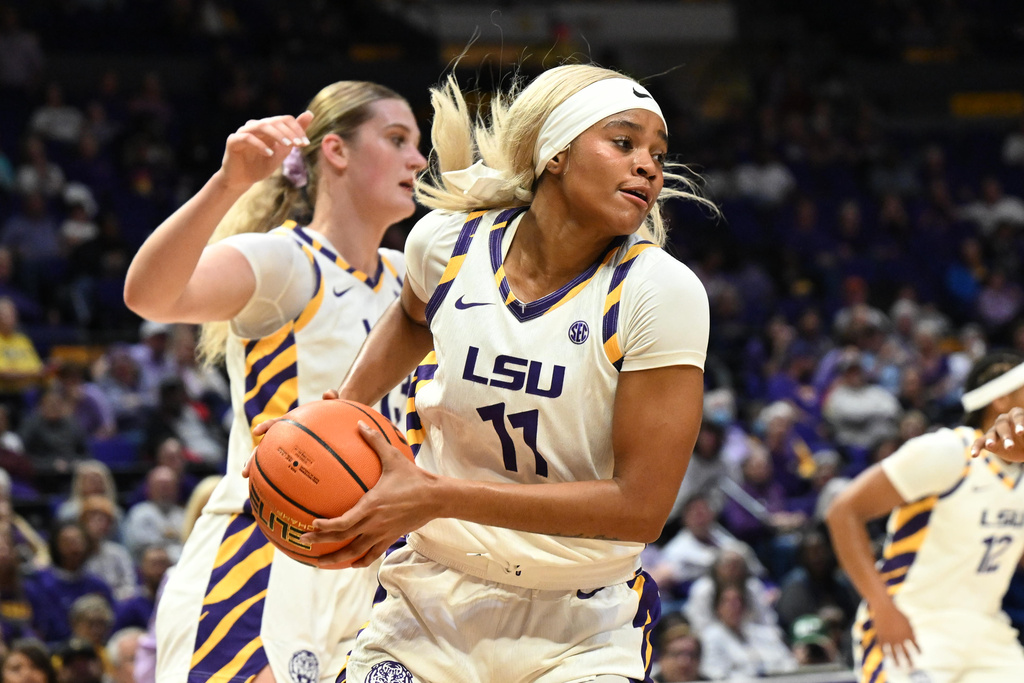 LSU guard ZaKiyah Johnson (11) holds the ball in the first half of an NCAA college basketball game against Charlotte in Baton Rouge, La., Wednesday, Nov. 12, 2025. (AP Photo/Ella Hall)