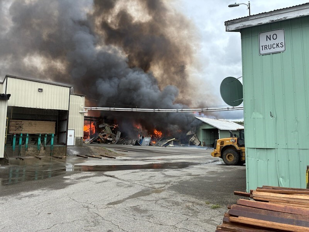 This photo provided by the Maine Department of Public Safety shows flames from a large fire at Robbins Lumber in Searsmont, Maine on Friday, May 15, 2026 (Maine Department of Public Safety via AP)