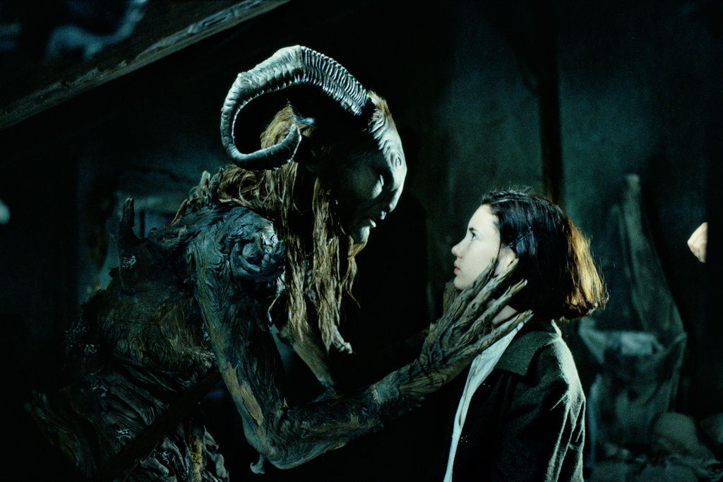 This image released by Cineverse shows Doug Jones, left, and Ivana Baquero in a scene from the 2006 film "Pan's Labyrinth." (Cineverse via AP)