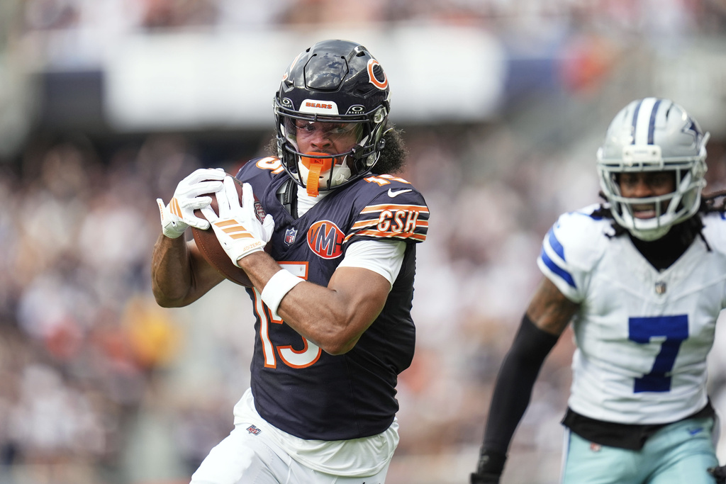 Chicago Bears wide receiver Rome Odunze sprints to the end zone for a touchdown after catching a pass as Dallas Cowboys cornerback Trevon Diggs (7) defends in the first half of an NFL football game Sunday, Sept. 21, 2025, in Chicago. (AP Photo/Erin Hooley)