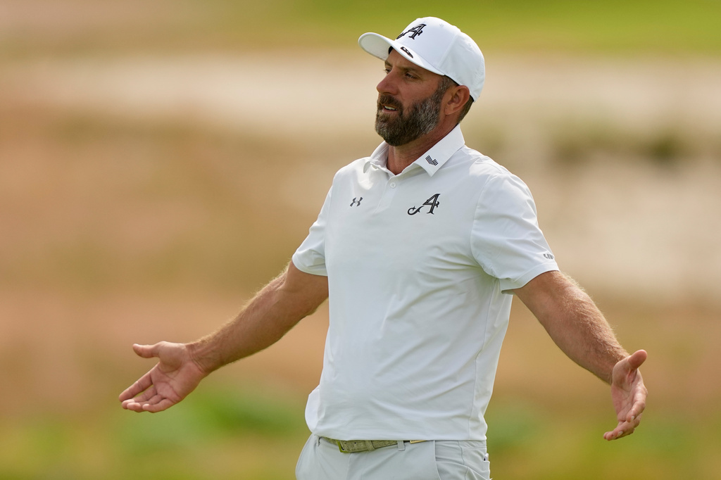 Dustin Johnson reacts after missing a putt on the sixth hole during the second round of the U.S. Open golf tournament at Shinnecock Hills Golf Club in Southampton, N.Y., Friday, June 19, 2026.(AP Photo/Gerald Herbert)