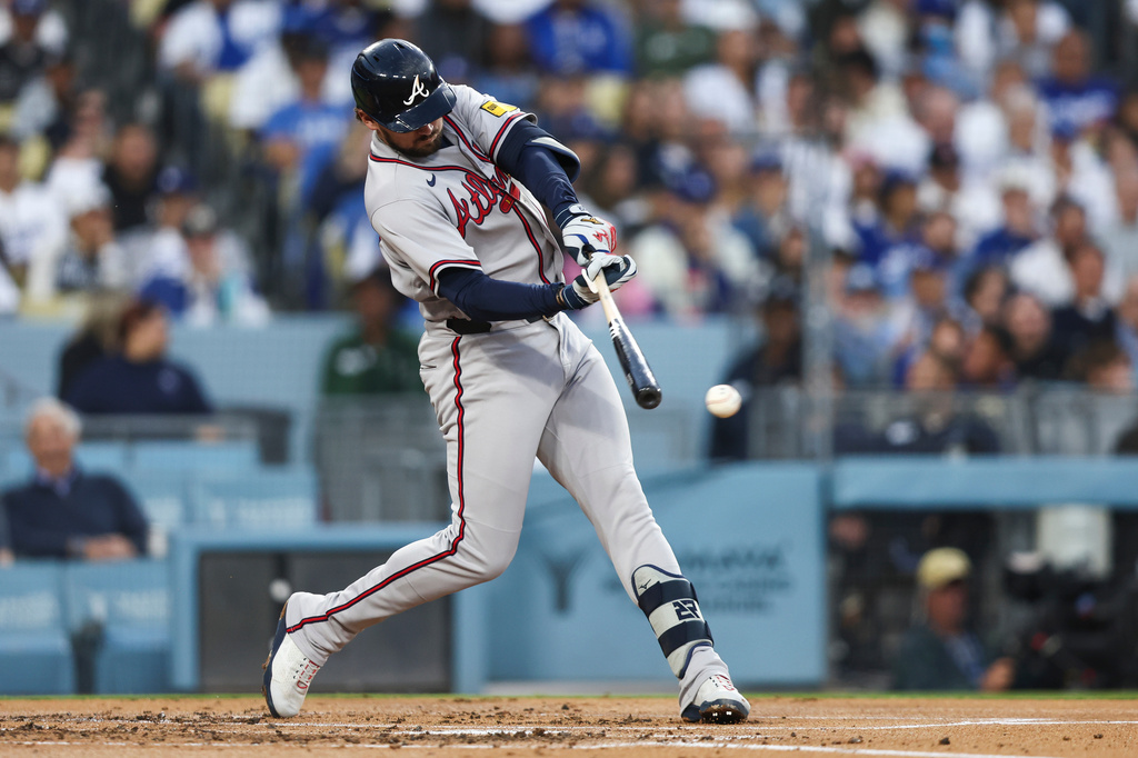 Atlanta Braves' Austin Riley hits an RBI single during the second inning of a baseball game against the Los Angeles Dodgers, Friday, May 8, 2026, in Los Angeles. (AP Photo/Jessie Alcheh)