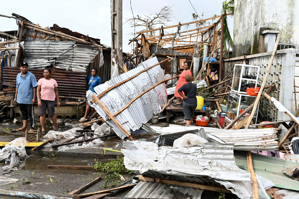 People survey the damage done by cyclone Gezani in Toamasina, Madagascar, Wednesday, Feb. 11, 2026. (AP Photo/Hery Nirina Rabary)