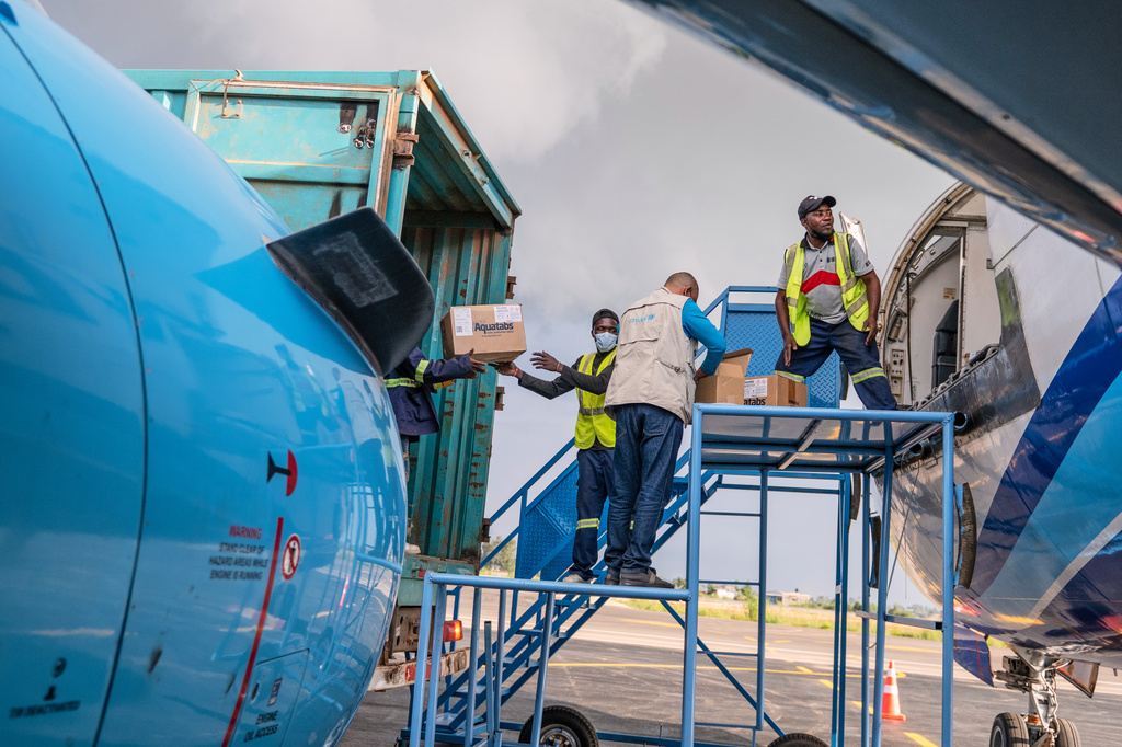 People offload a shipment of more than 15 tons of supplies donated by UNICEF as part of the response to the Ebola virus outbreak at Bunia National Airport in Bunia, Congo, Tuesday, May 19, 2026. (AP Photo/Moses Sawasawa)