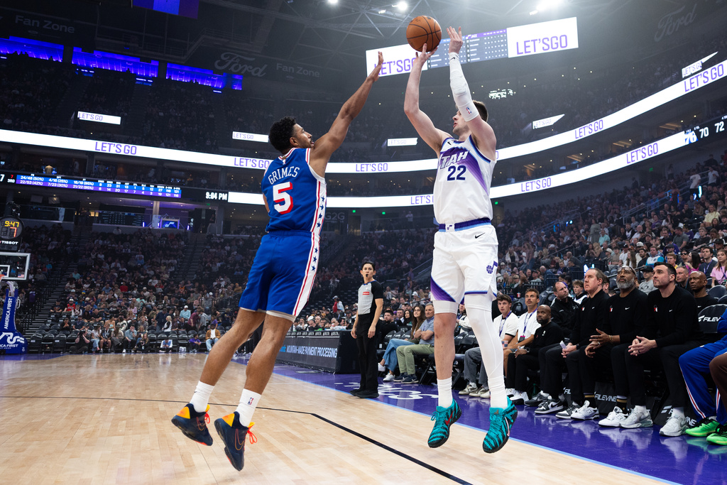 Philadelphia 76ers guard Quentin Grimes (5) defends against Utah Jazz center Kyle Filipowski (22) as he shoots a three during the second half of an NBA basketball game, Saturday, March 21, 2026, in Salt Lake City. (AP Photo/Anna Fuder)