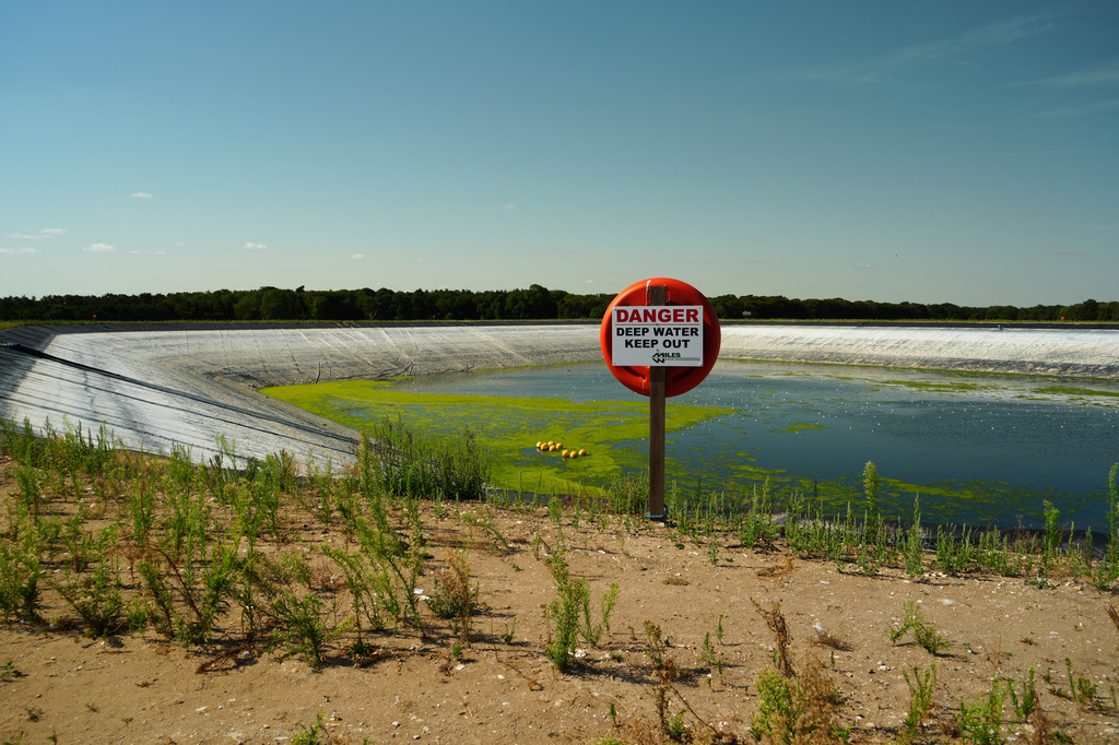 The 'Summer Pit' water reservoir on the Elveden Estate shows low water levels amid a nationwide drought, in Thetford, England, Tuesday, Aug. 11, 2026. (AP Photo/Mustakim Hasnath)