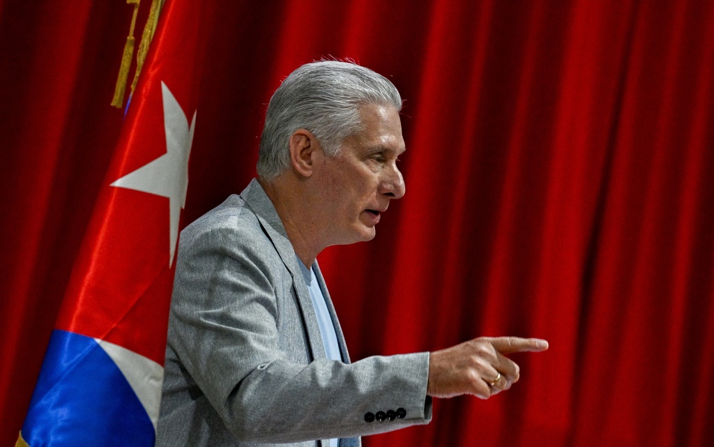 Cuban President Miguel Diaz-Canel delivers a welcome speech to participants of the "Nuestra America," or Our America Convoy at the Convention Palace in Havana, Cuba, Friday, March 20, 2026.(Adalberto Roque/Pool Photo via AP)