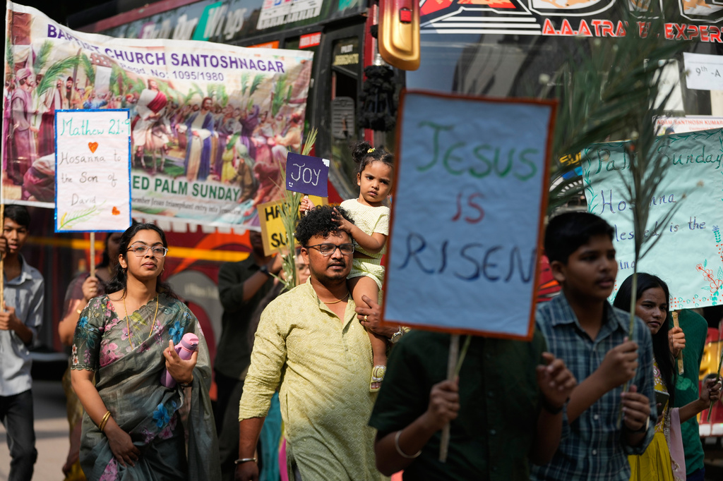 Christian devotees hold palm leaves during a Palm Sunday procession marking the sixth and final Sunday of Lent and the beginning of Holy Week in Hyderabad, India, Sunday, March 29, 2026. (AP Photo/Mahesh Kumar A.)