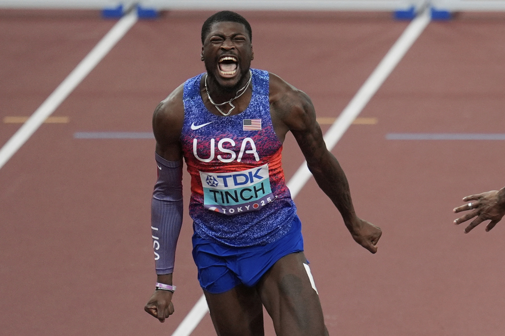 United States' Cordell Tinch crosses the finish line to win the men's 110 meters hurdles final at the World Athletics Championships in Tokyo, Tuesday, Sept. 16, 2025. (AP Photo/Abbie Parr)