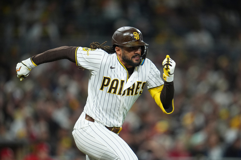 San Diego Padres' Fernando Tatis Jr. runs to first on his way to a single during the seventh inning of a baseball game against the St. Louis Cardinals Thursday, May 7, 2026, in San Diego. (AP Photo/Gregory Bull)