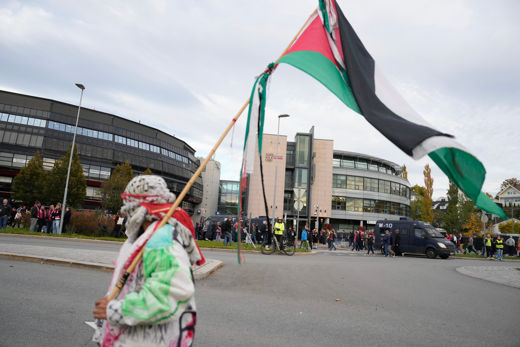 Pro-Palestinians protesters outside the Ullevaal Stadium ahead of the World Cup qualifying soccer match between Norway and Israel, in Oslo, Saturday, Oct. 11, 2025. (Javad Parsa/NTB Scanpix via AP)