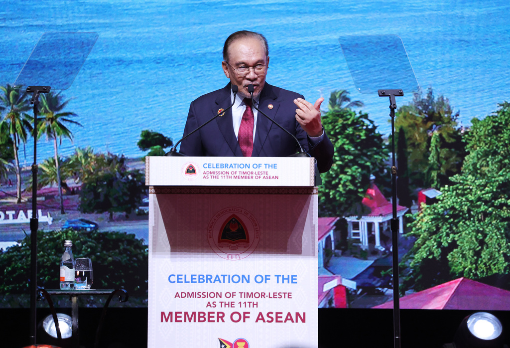 Malaysia's Prime Minister Anwar Ibrahim delivers his speech during a reception for East Timor's admission to ASEAN on the sidelines of the Association of Southeast Asian Nations (ASEAN) summit at the Kuala Lumpur Convention Centre in Kuala Lumpur, Malaysia, Monday, Oct. 27, 2025. (How Hwee Young/Pool Photo via AP)