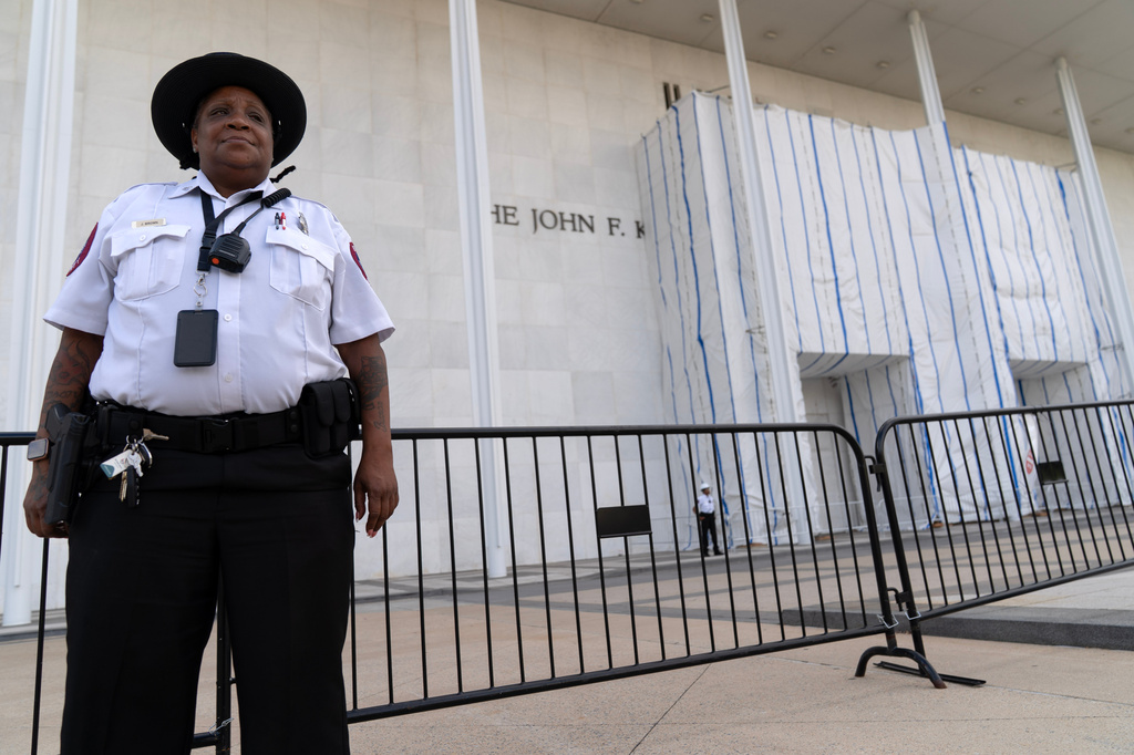 A security guard standing outside during a demonstration a the John F. Kennedy Center for the Performing Arts on Friday, Sept. 18, 2026, in Washington. ( (AP Photo/Jose Luis Magana)