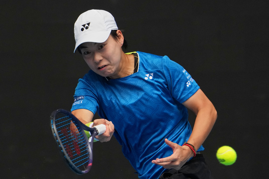 Bai Zhuoxuan of China plays a forehand return to Aryna Sabalenka of Belarus during their second round match at the Australian Open tennis championship in Melbourne, Australia, Wednesday, Jan. 21, 2026. (AP Photo/Dita Alangkara)