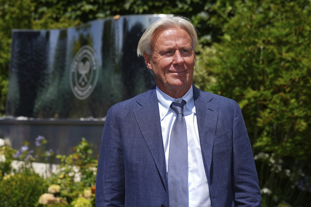 FILE - Tennis great Bjorn Borg poses for a photo as he arrives for Day 11 at the Wimbledon Tennis Championships in London, July 10, 2025. (AP Photo/Joanna Chan, File)