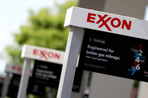 FILE- This April 25, 2017, file photo, shows Exxon service station signs in Nashville, Tenn. (AP Photo/Mark Humphrey, File) FILE- This April 25, 2017, file photo, shows Exxon service station signs in Nashville, Tenn. (AP Photo/Mark Humphrey, File)