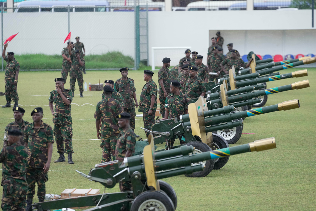 Tanzanian Army fires a 21 gun salute during the inauguration of Zanzibar President elect Hussein Ali Mwinyi of the ruling Chama Cha Mapinduzi (Revolutionary Party) at Amaan Stadium in Zanzibar, Tanzania, Saturday, Nov. 1, 2025. (AP Photo/Brian Inganga)