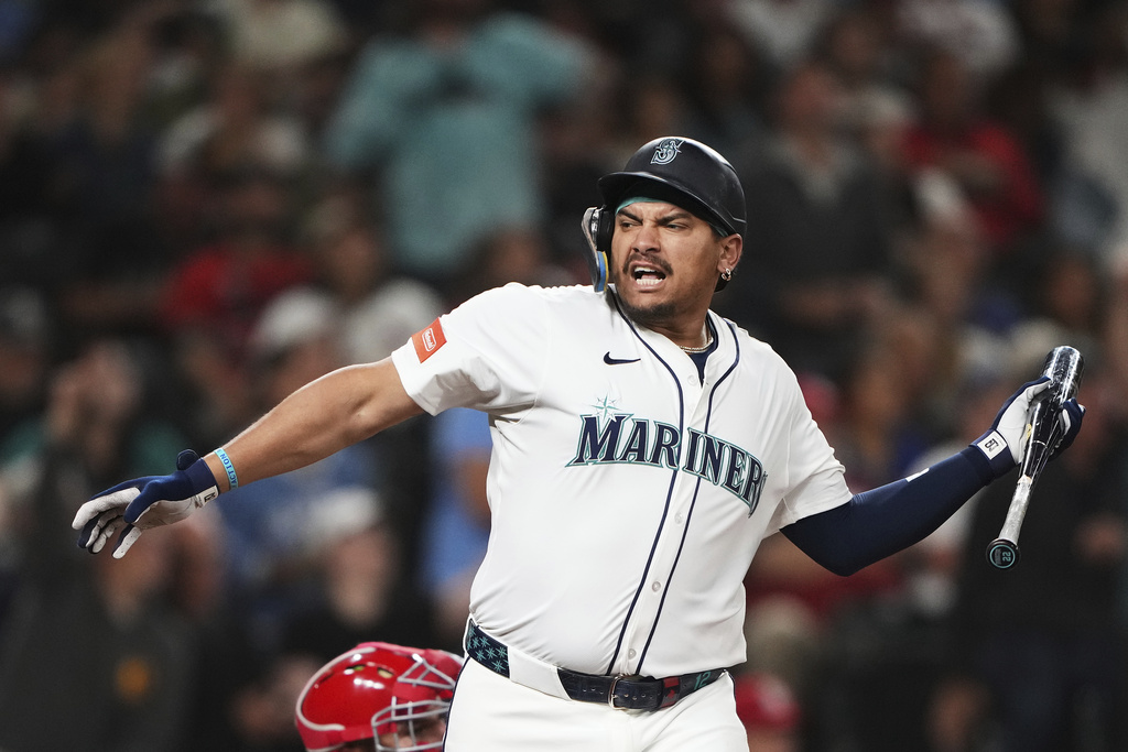 Seattle Mariners' Josh Naylor reacts after hitting a solo home run against the St. Louis Cardinals during the fourth inning of a baseball game Tuesday, Sept. 9, 2025, in Seattle. (AP Photo/Lindsey Wasson)