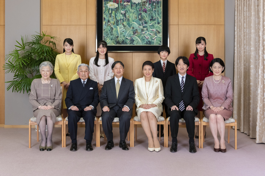 FILE - In this photo released by Imperial Household Agency of Japan, Japan's Emperor Naruhito, seated third from left, and Empress Masako, seated third from right, pose with their family members for a family photo session for the New Year, at their residence in Tokyo on Dec. 12, 2019. Imperial family members are, front left to right, Empress Emerita Michiko, Emperor Emeritus Akihito, Naruhito, Masako, Crown Prince Akishino, and Crown Princess Kiko, and, back from left to right, Princess Mako, Princess Aiko, Prince Hisahito, and Princess Kako. (Imperial Household Agency of Japan via AP, File)