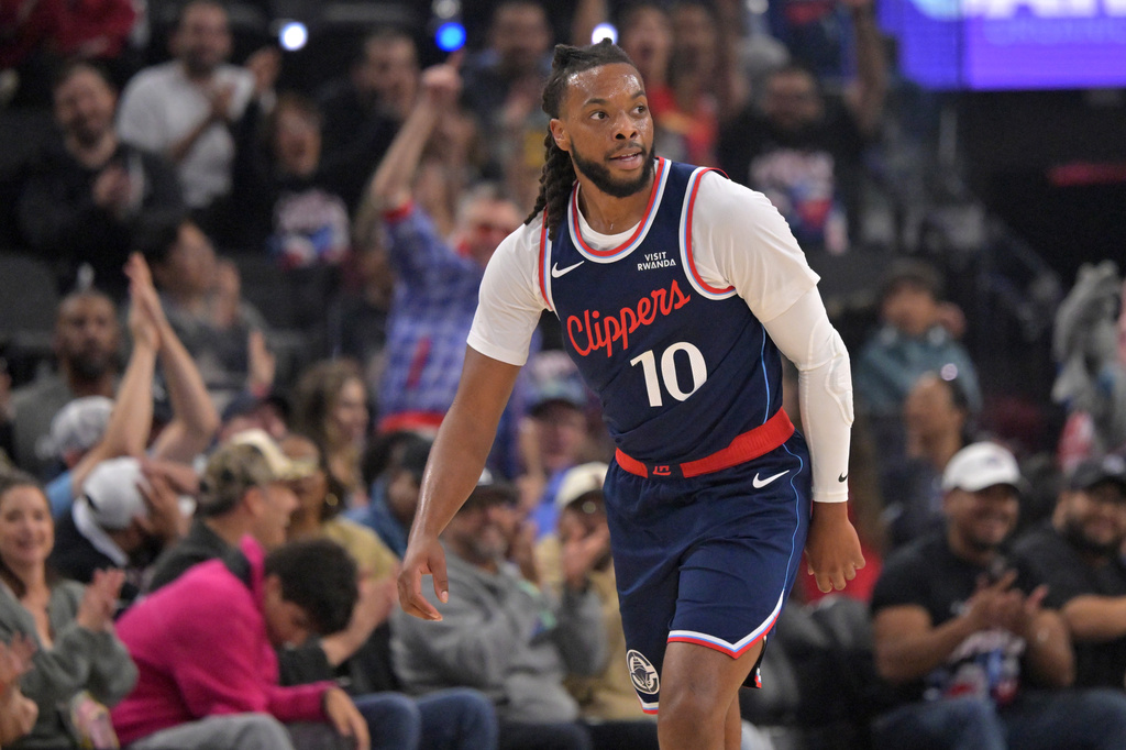 Los Angeles Clippers' Darius Garland heads down court after a 3-point basket during an NBA basketball game against the Sacramento Kings, Wednesday, Oct. 21, 2026, in Los Angeles. (AP Photo/Jayne Kamin-Oncea)