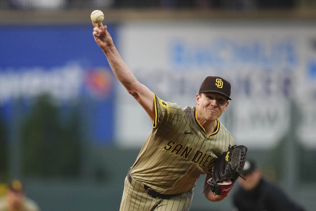 San Diego Padres starting pitcher Nick Pivetta throws to the plate against the Colorado Rockies during the first inning of a baseball game Friday, Sept. 5, 2025, in Denver. (AP Photo/Jack Dempsey)