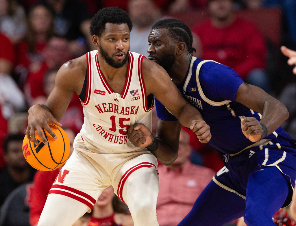 Nebraska's Jared Garcia, left, drives against Washington's Franck Kepnang during the second half of an NCAA college basketball game Wednesday, Jan. 21, 2026, in Lincoln, Neb. (AP Photo/Rebecca S. Gratz)