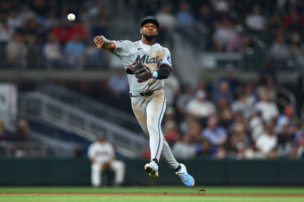Miami Marlins shortstop Otto Lopez throws to first base in the seventh inning of a baseball game against the Atlanta Braves, Tuesday, April 14, 2026, in Atlanta. (AP Photo/Colin Hubbard)