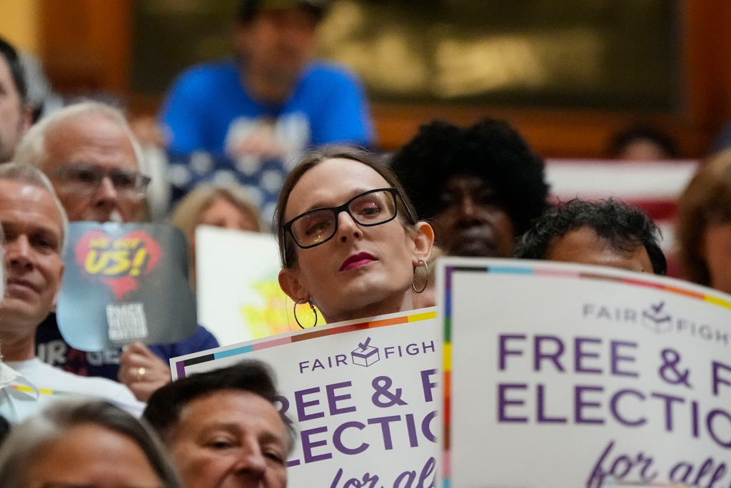 Eve Dunn, of Savannah, Ga., listens to speakers during a special legislative session at the state capitol, Wednesday, June 17, 2026, in Atlanta. (AP Photo/Mike Stewart)