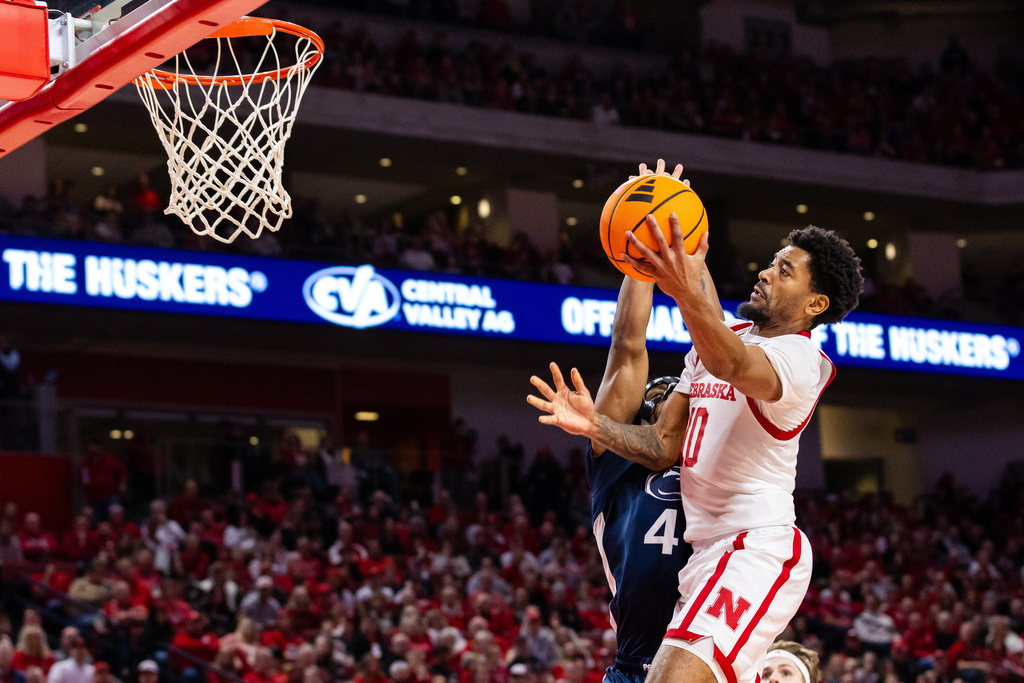 Nebraska guard Jamarques Lawrence (10) goes up for a basket against Penn State guard Kayden Mingo (4) during the first half of an NCAA college basketball game, Saturday, Feb. 21, 2026, in Lincoln, Neb. (AP Photo/Bonnie Ryan)