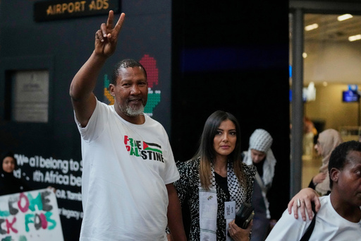 Mandla Mandela with his wife Rabia, arrives with members of the Global Sumud Flotilla, at OR Tambo International Airport, in Johannesburg, South Africa, Wednesday, Oct. 8, 2025. (AP Photo/Themba Hadebe) Mandla Mandela with his wife Rabia, arrives with members of the Global Sumud Flotilla, at OR Tambo International Airport, in Johannesburg, South Africa, Wednesday, Oct. 8, 2025. (AP Photo/Themba Hadebe)