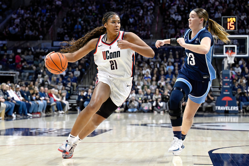 FILE - UConn forward Sarah Strong (21) is guarded by Villanova forward Brynn McCurry (13) in the first half of an NCAA college basketball game, Thursday, Jan. 15, 2026, in Storrs, Conn. (AP Photo/Jessica Hill, File)