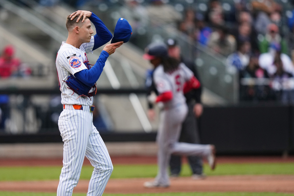 New York Mets pitcher Luke Weaver, left, reacts as Washington Nationals' CJ Abrams runs the bases after hitting a two run home run during the eighth inning of a baseball game Thursday, April 30, 2026, in New York. (AP Photo/Frank Franklin II)