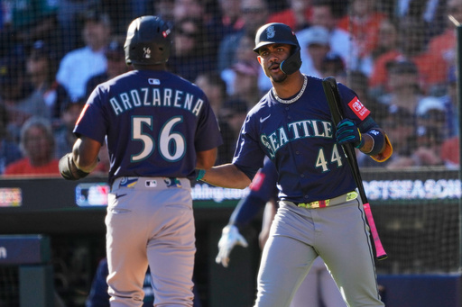 Seattle Mariners' Randy Arozarena (56) is congratulated by teammate Julio Rodríguez (44) after scoring during the fifth inning in Game 4 of baseball's American League Division Series against the Detroit Tigers Wednesday, Oct. 8, 2025, in Detroit. (AP Photo/Ryan Sun) Seattle Mariners' Randy Arozarena (56) is congratulated by teammate Julio Rodríguez (44) after scoring during the fifth inning in Game 4 of baseball's American League Division Series against the Detroit Tigers Wednesday, Oct. 8, 2025, in Detroit. (AP Photo/Ryan Sun)