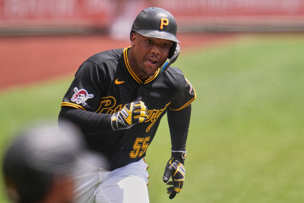 Pittsburgh Pirates' Esmerlyn Valdez runs to score from second base on a double by teammate Ryan O'Hearn off Milwaukee Brewers pitcher Robert Gasser during the first inning of a baseball game in Pittsburgh, Sunday, July 12, 2026. (AP Photo/Gene J. Puskar)