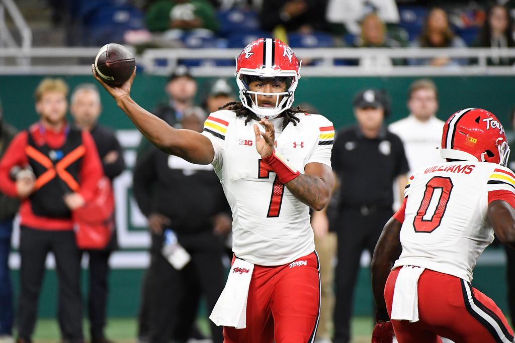 Maryland quarterback Malik Washington passes during the first half of an NCAA college football game against Michigan State, Saturday, Nov. 29, 2025, in Detroit. (AP Photo/Jose Juarez)