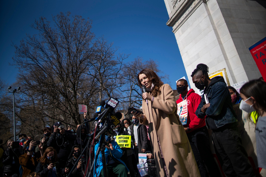 FILE - Lindsey Boylan, left, a former adviser for Gov. Andrew Cuomo, speaks at a march calling for his impeachment at Washington Square Park in New York on March 20, 2021. (AP Photo/Eduardo Munoz Alvarez, File)