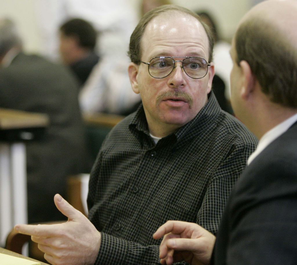 FILE - Steven Bixby, left, talks to his public defender, Charles Grose at the start of his murder trial Wednesday, Feb. 14, 2007, in Abbeville, S.C. (AP Photo/Mary Ann Chastain, Pool, File)
