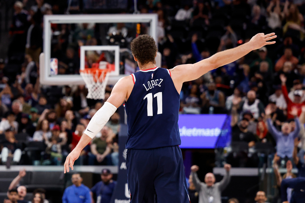 LA Clippers center Brook Lopez (11) reacts after scoring a three-pointer during the second half of an NBA basketball game against the Milwaukee Bucks, Monday, March 23, 2026, in Inglewood, Calif. (AP Photo/Caroline Brehman)