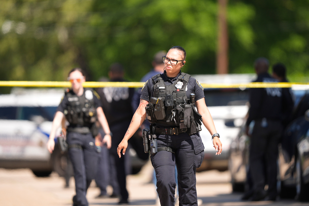 Police work outside the scene of a mass shooting, Sunday, April 19, 2026, in Shreveport, La. (AP Photo/Gerald Herbert)