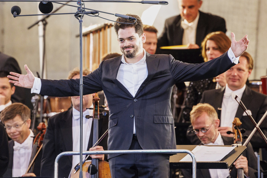 Israeli conductor Lahav Shani is onstage at the Munich Philharmonic's 'Klassik am Odeonsplatz' concert, in Munich, Germany, July 13, 2024. (Matthias Balk/dpa via AP)
