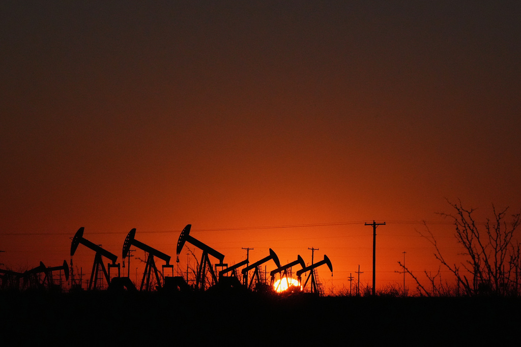 Pumpjacks work to extract oil as the sun rises in Midland, Texas, Jan. 20, 2025. (AP Photo/Rebecca Blackwell)