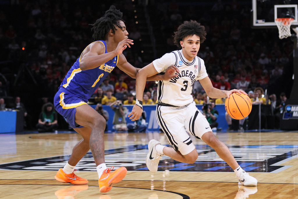 Vanderbilt guard Tyler Tanner (3) drives against McNeese guard Larry Johnson, left, during the second half in the first round of the NCAA college basketball tournament, Thursday, March 19, 2026, in Oklahoma City. (AP Photo/Nate Billings)