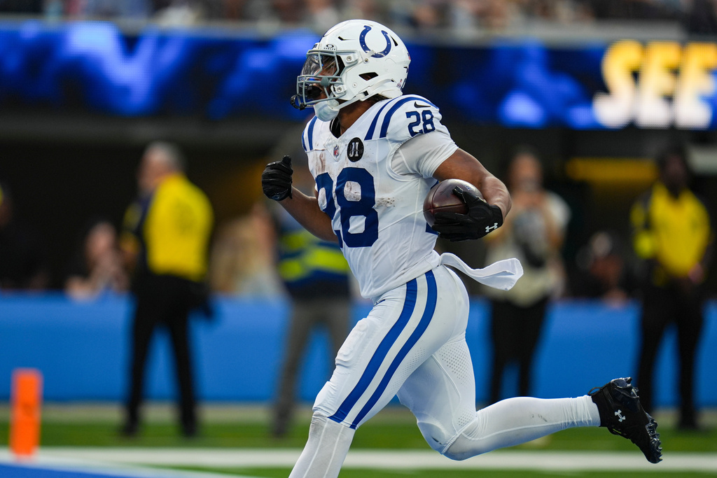 Indianapolis Colts running back Jonathan Taylor (28) runs in for a touchdown against the Los Angeles Chargers during the second half of an NFL football game Sunday, Oct. 19, 2025, in Inglewood, Calif. (AP Photo/Gregory Bull)