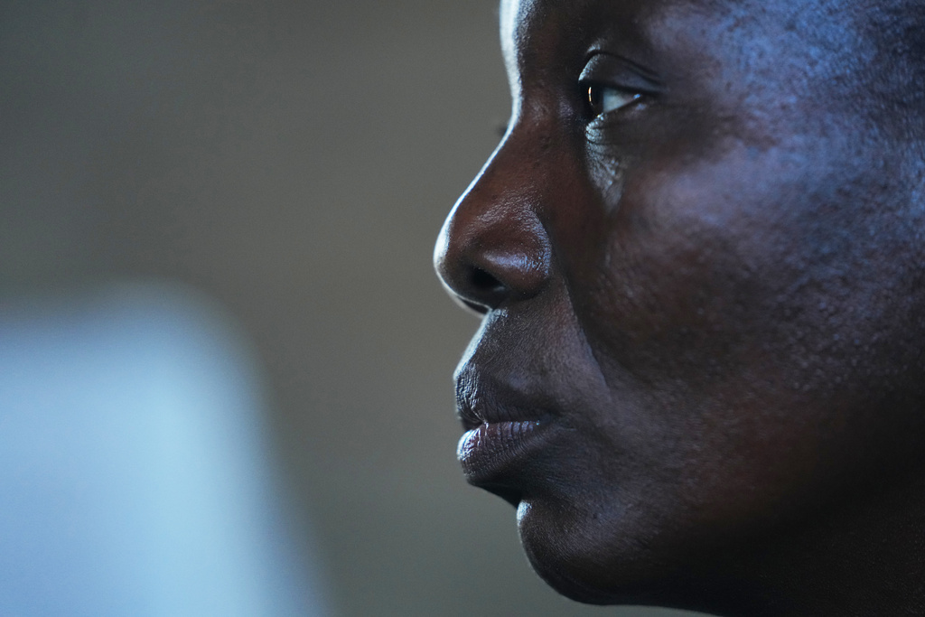 Deborah Reuben, a woman who was kidnapped with others in her community and later released after ransom was paid, listens to a question during an interview in Kaduna, northwestern, Nigeria, Thursday, Nov. 6, 2025. (AP Photo/Sunday Alamba)