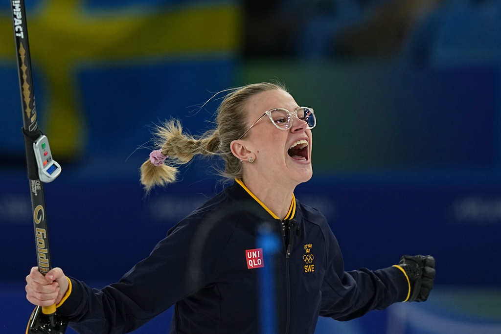 Sweden's Isabella Wranaa celebrates after winning the gold medal mixed doubles curling match against USA, at the 2026 Winter Olympics, in Cortina D'Ampezzo, Italy, Tuesday, Feb. 10, 2026. (AP Photo/Fatima Shbair)