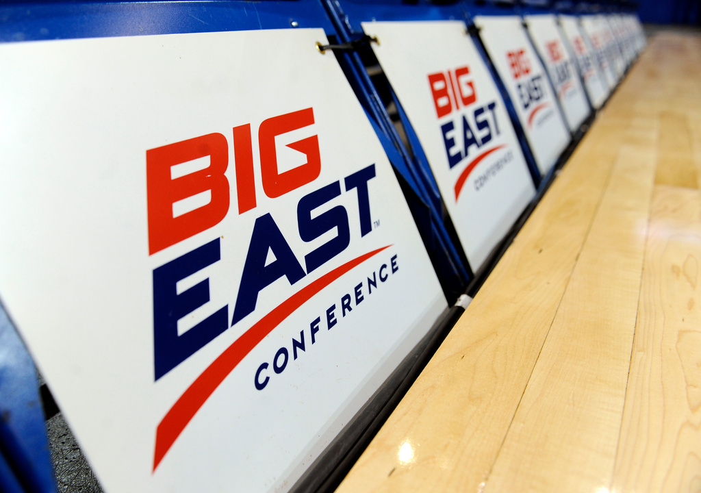 FILE - The logo for the Big East Conference is displayed on a row of court side chairs at the Big East Conference women's basketball tournament in Hartford, Conn., March 8, 2013. (AP Photo/Jessica Hill, File)